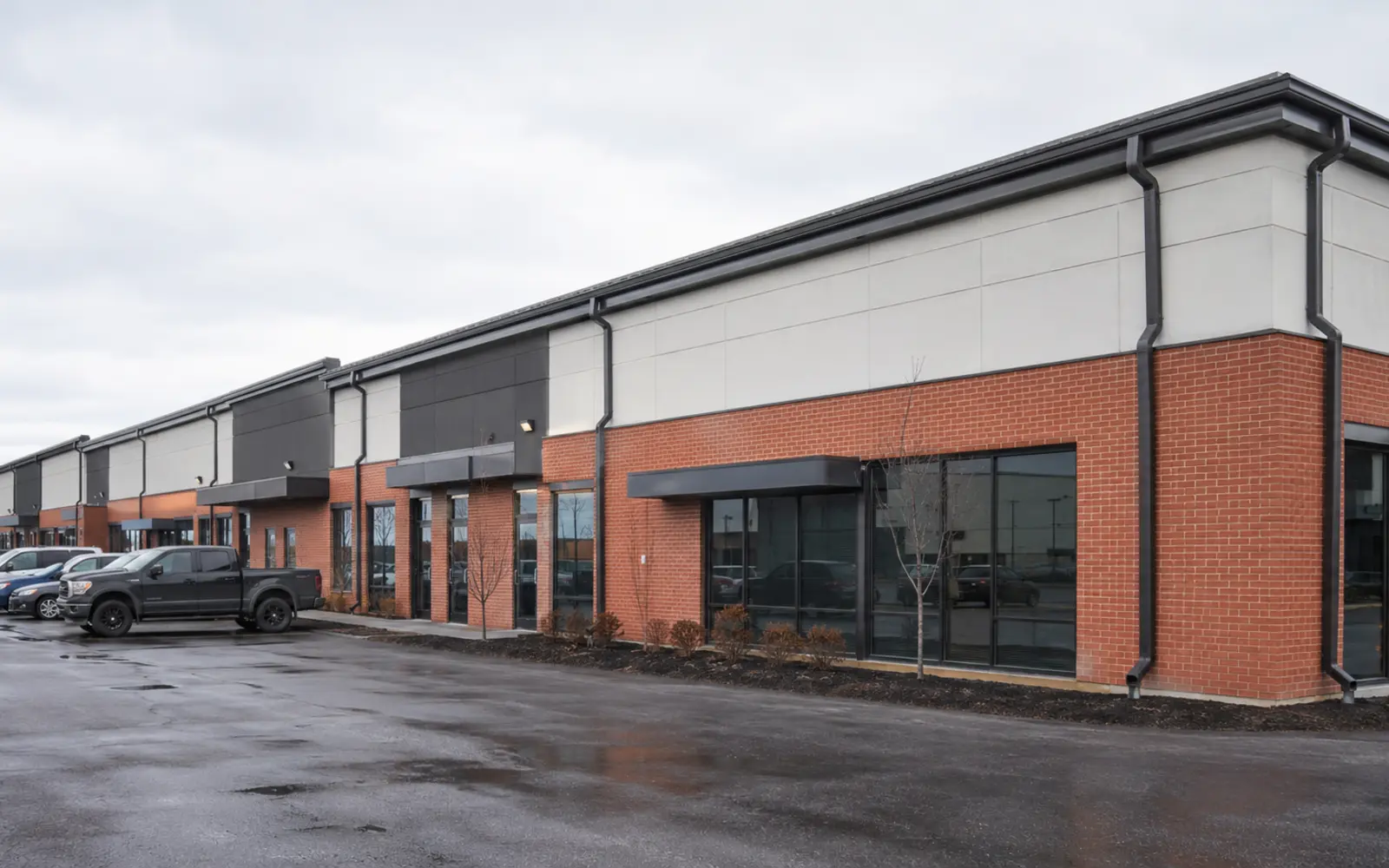 Low-rise commercial property with exterior gutters and downspouts